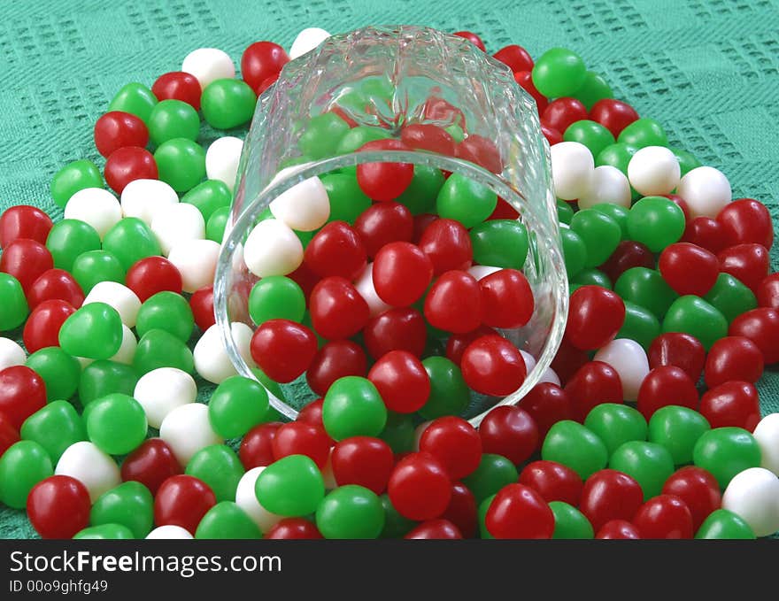 Colorful Christmas candy spill from a glass.