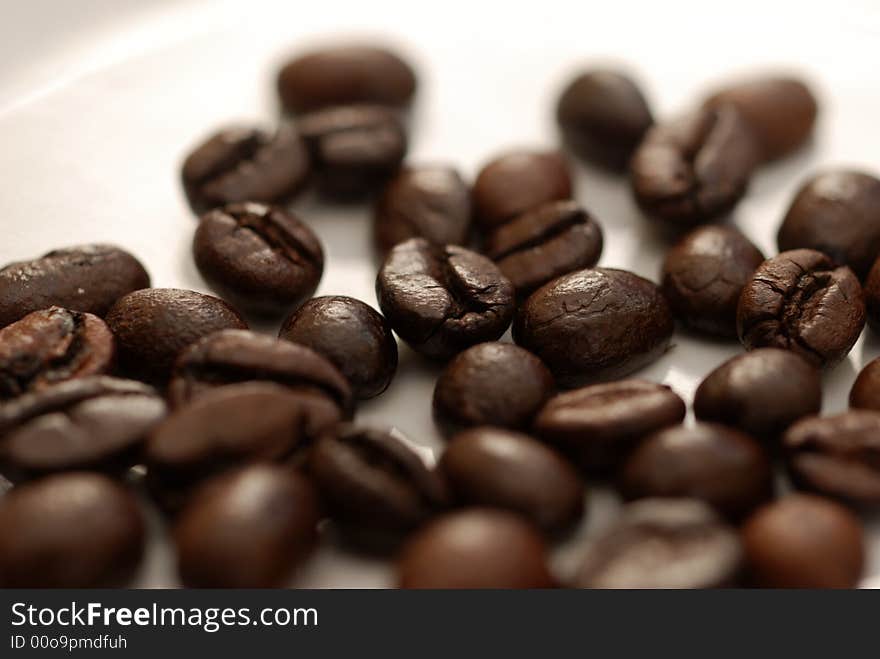 A close up image of coffee beans. A close up image of coffee beans