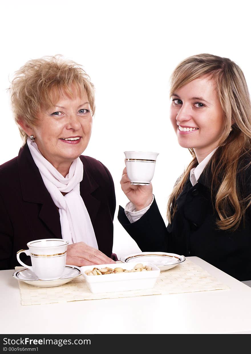 Mother and daughter drinking coffee together