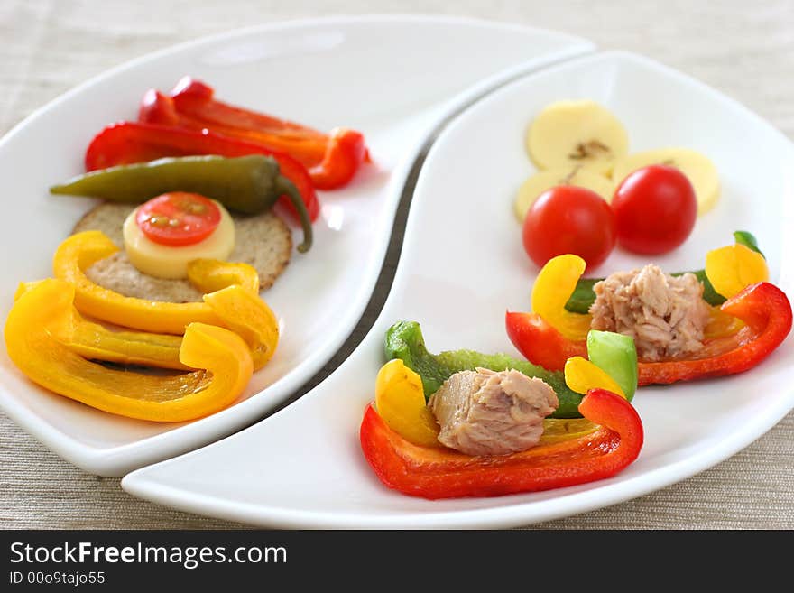 Healthy colorful platter with assorted vegetables on fancy white china. Healthy colorful platter with assorted vegetables on fancy white china