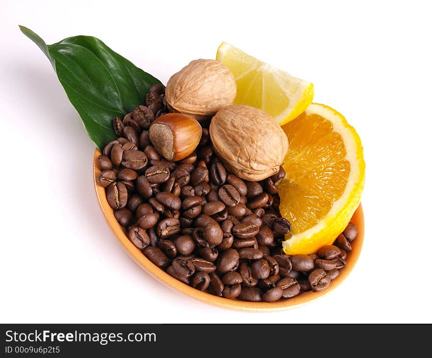 Coffee beans, juicy oranges, walnut and lemon. Coffee beans, juicy oranges, walnut and lemon