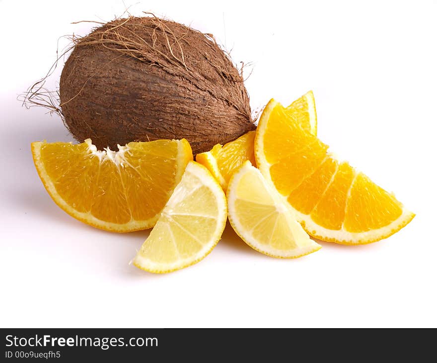 Juicy oranges, lemon and coconut on the white background. Juicy oranges, lemon and coconut on the white background