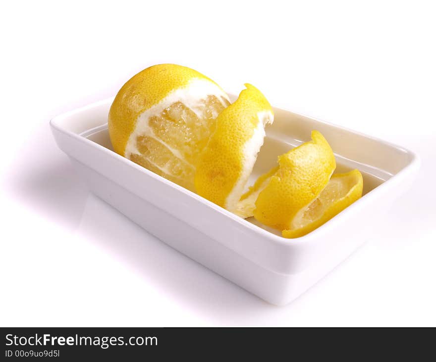 Juicy lemon in the white bowl