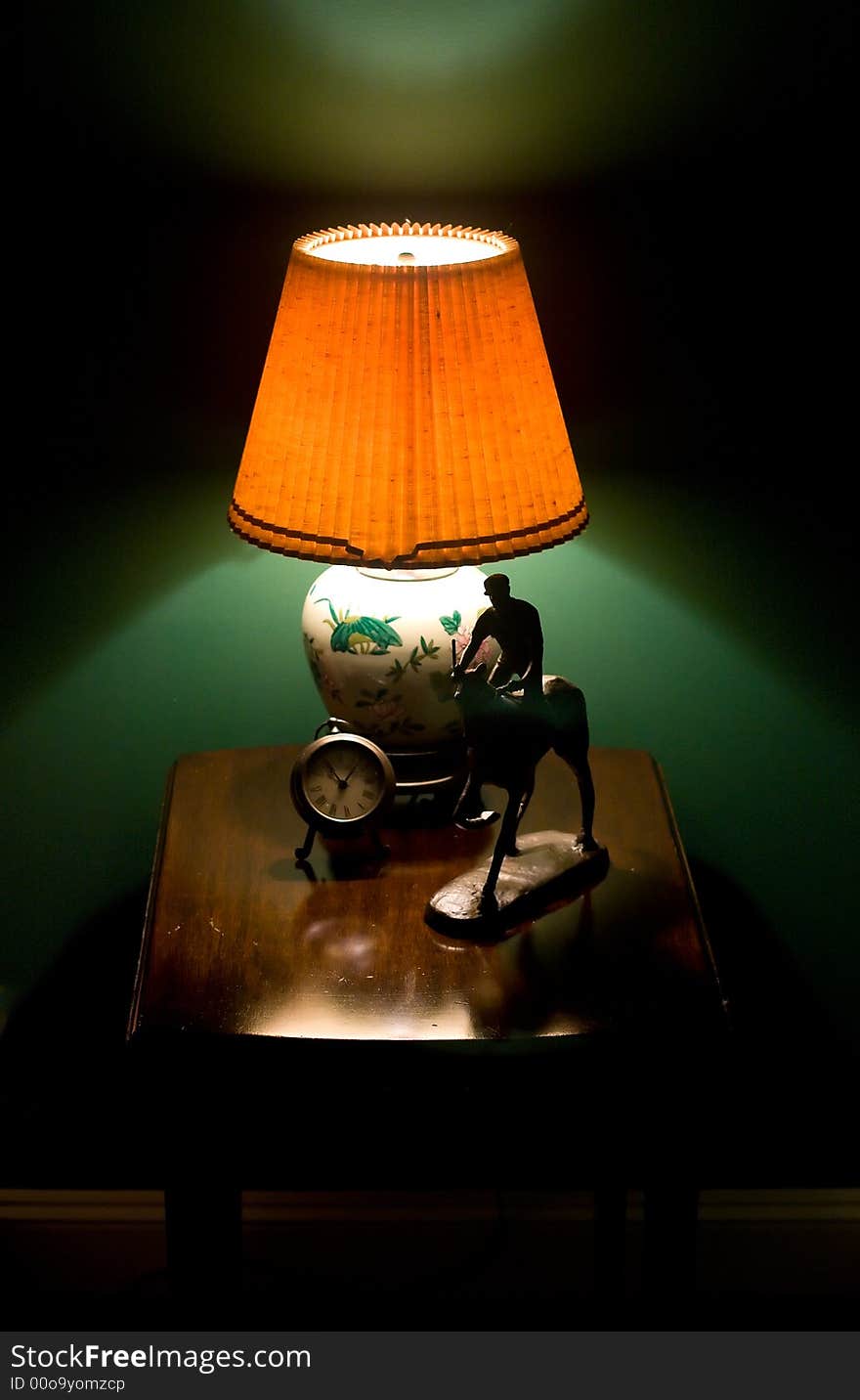 Lamp, clock, and horse model on a lamp stand. Lamp, clock, and horse model on a lamp stand