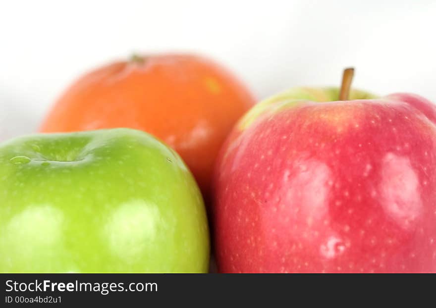 Orange and apples isolated on white background