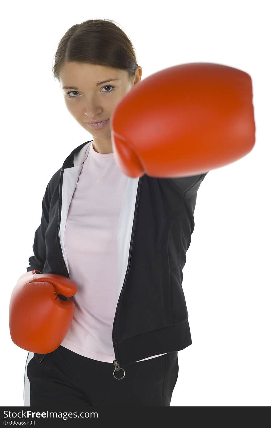 Young beauty with boxing gloves. Trying to hit somebody. Looking at camera. White background, front view. Young beauty with boxing gloves. Trying to hit somebody. Looking at camera. White background, front view