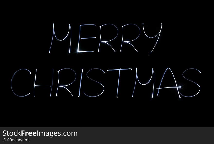 Luminous merry christmas wish on dark background