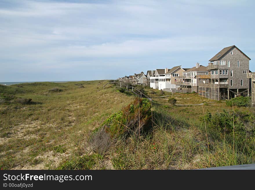 Houses at the ocean by sand dunes for vacation