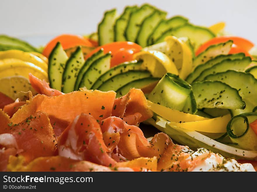 Closeup of cold meat and fresh vegetables