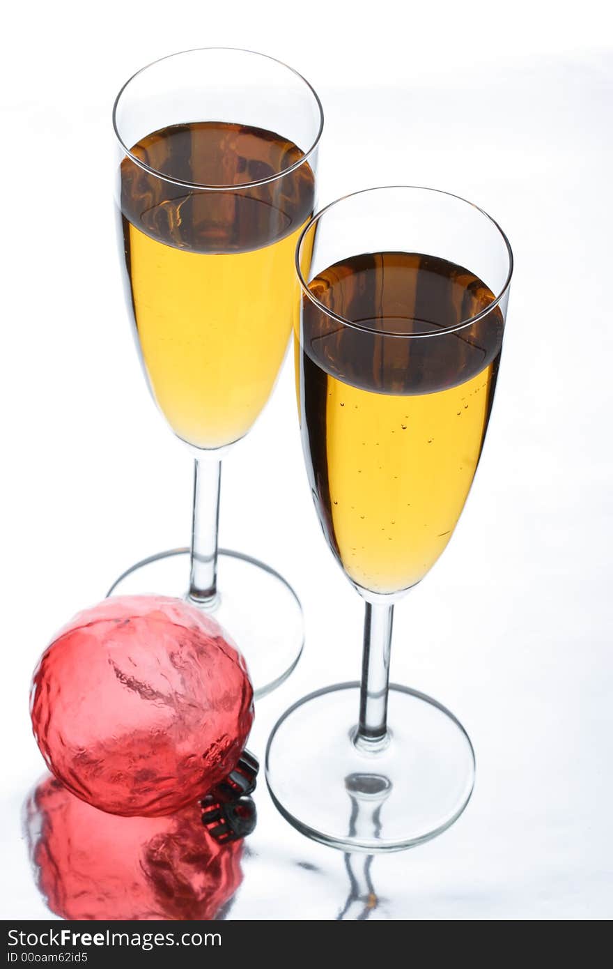 Two glasses in which champagne is poured. Two glasses in which champagne is poured