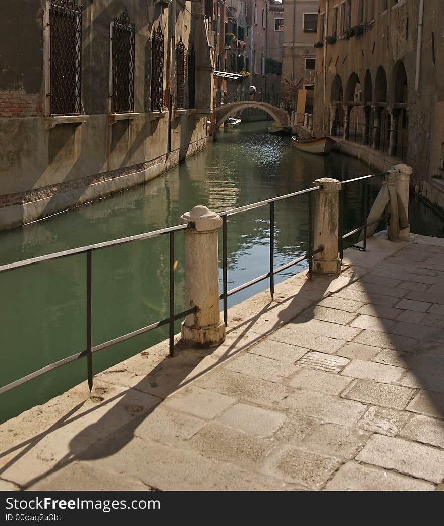 Canal and bridge in back street shot in Venice. Canal and bridge in back street shot in Venice