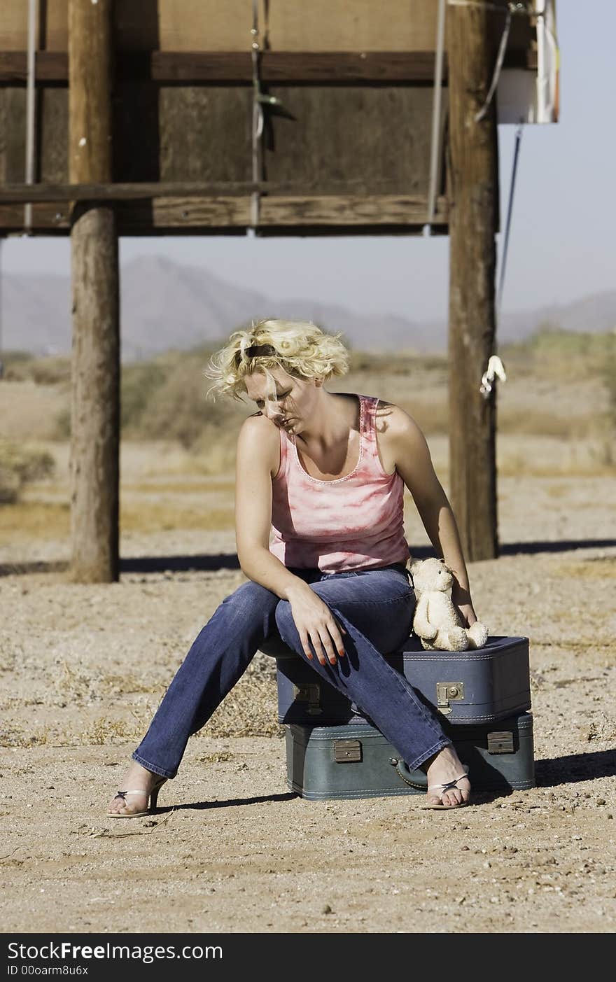 Woman Sitting On Suitcases