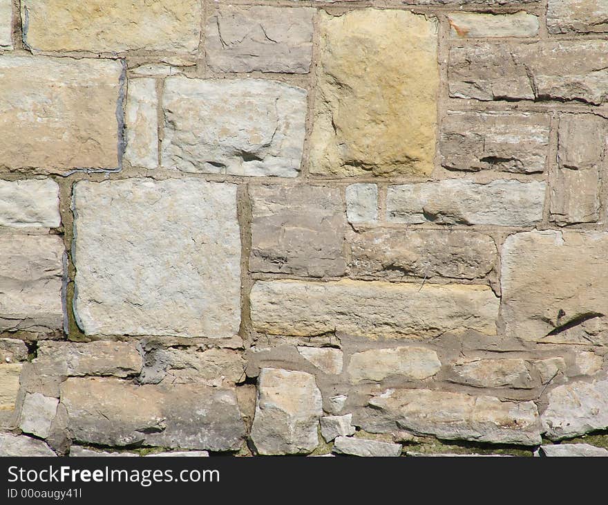 Light neutral colored old stone wall background