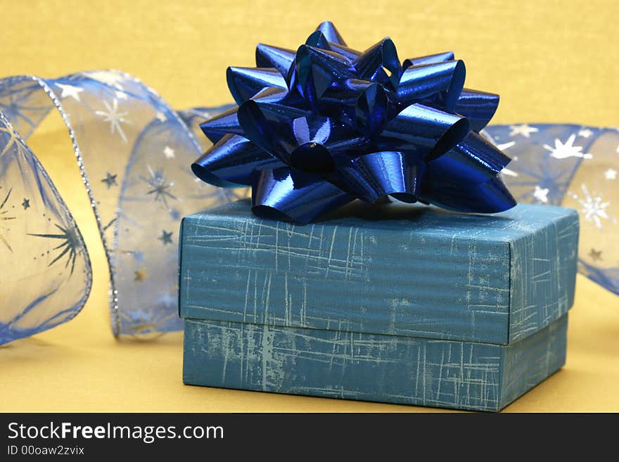 Blue gift box and silver celebration ribbon