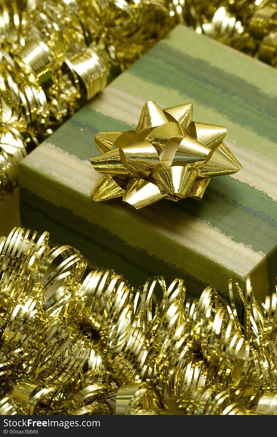 Green gift box and golden garland