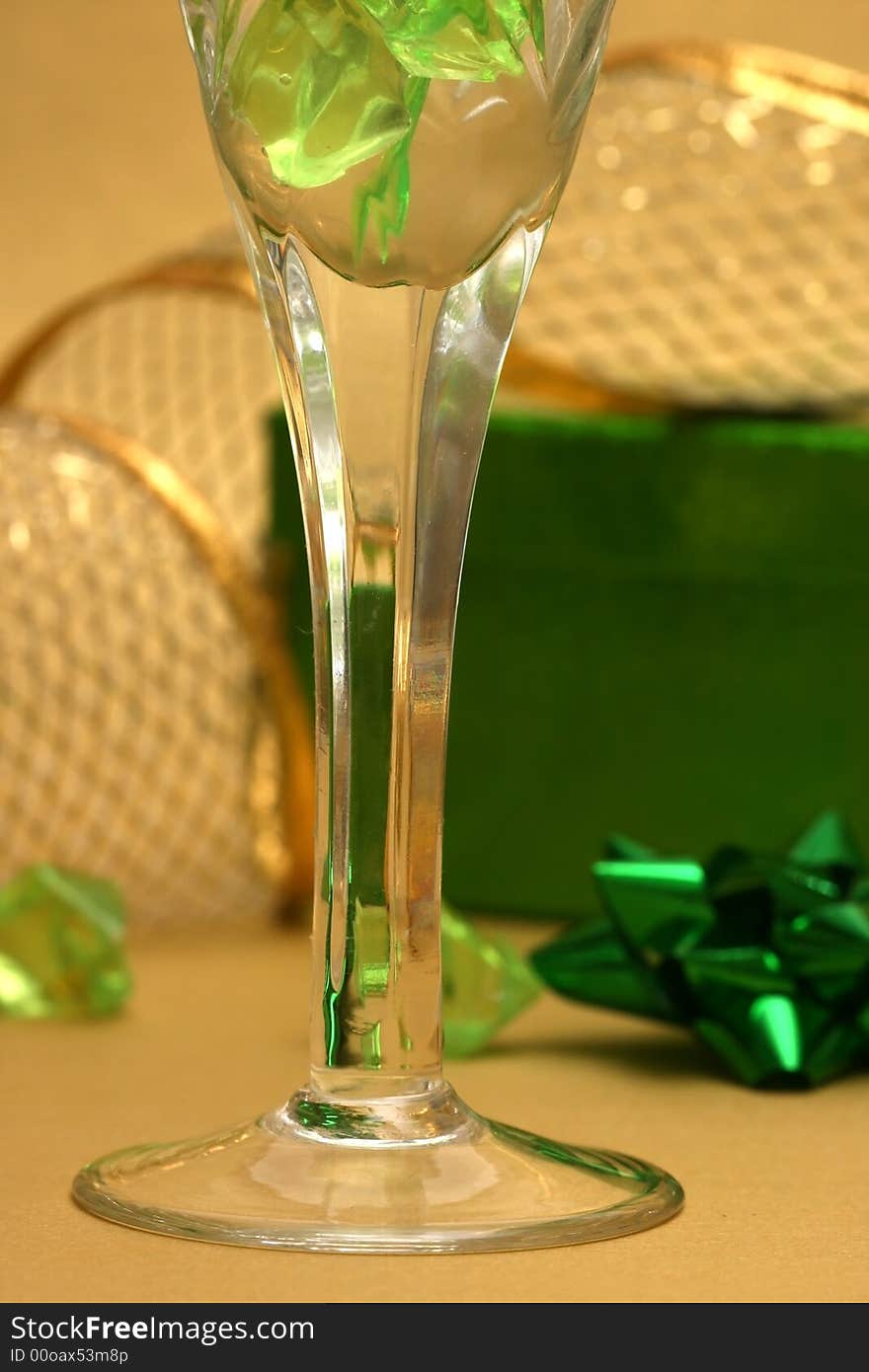 Celebration table green gift box and glass