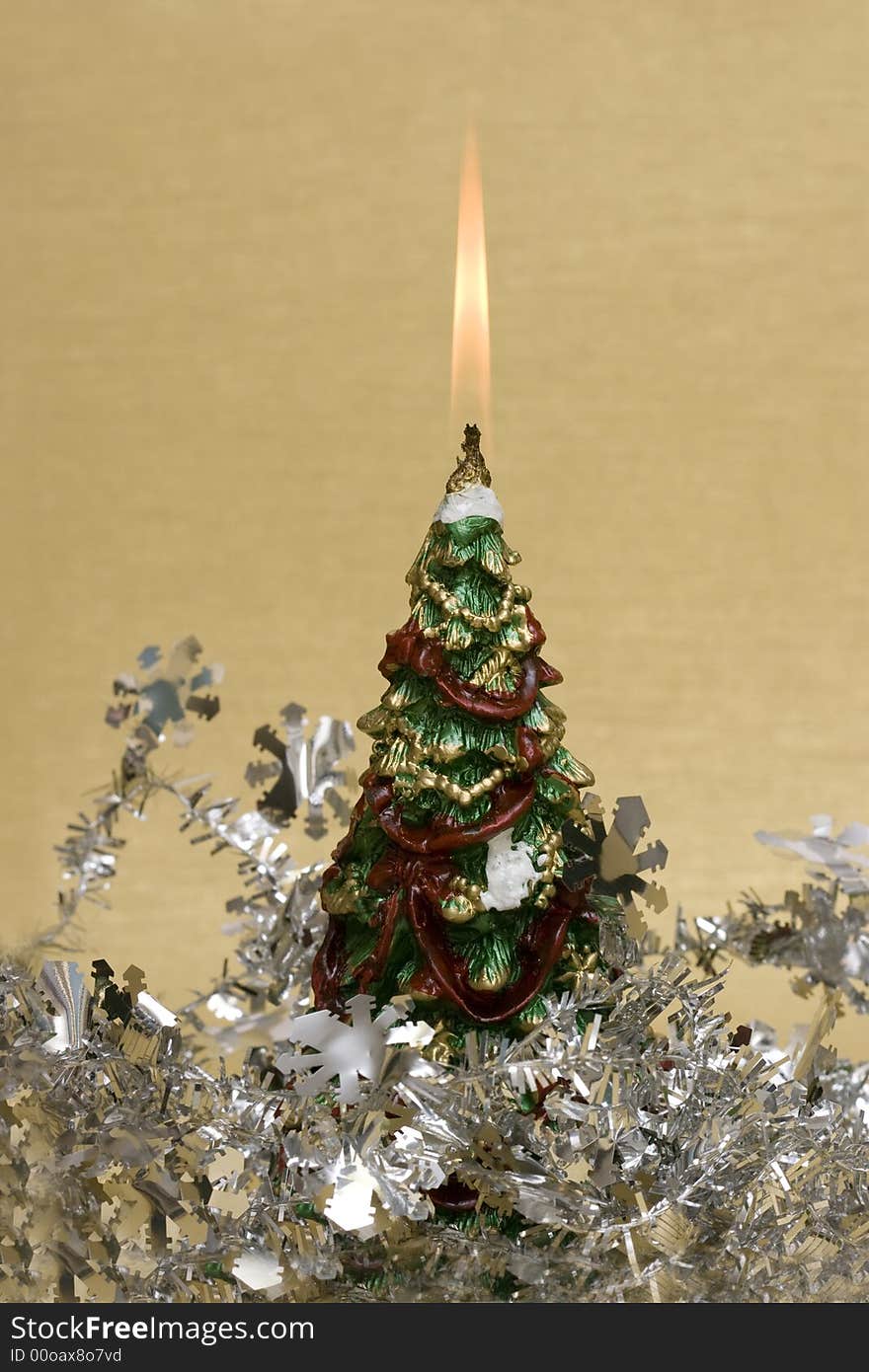 Festive new-year candle with Christmas tree