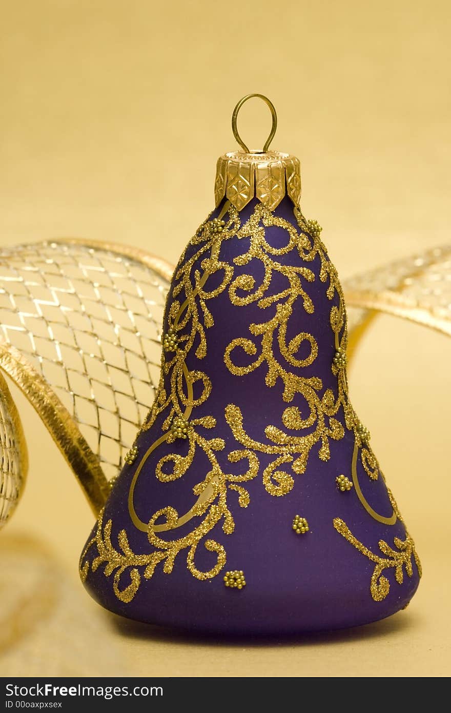 Violet Christmas bell with golden ribbon