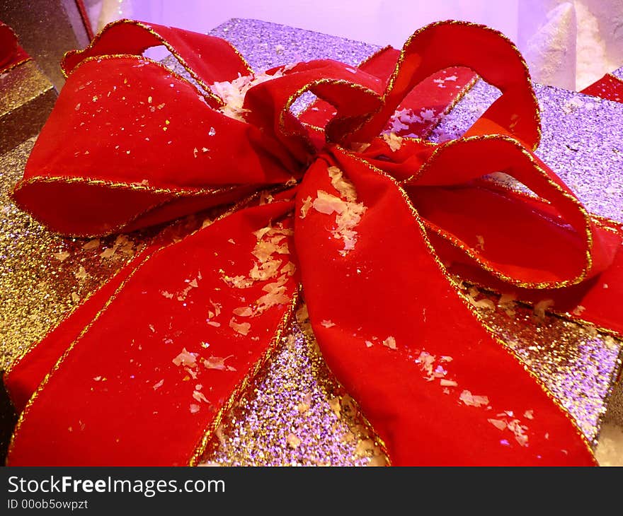 Photo of christmas present tied with a colorful red ribbon. Photo of christmas present tied with a colorful red ribbon.