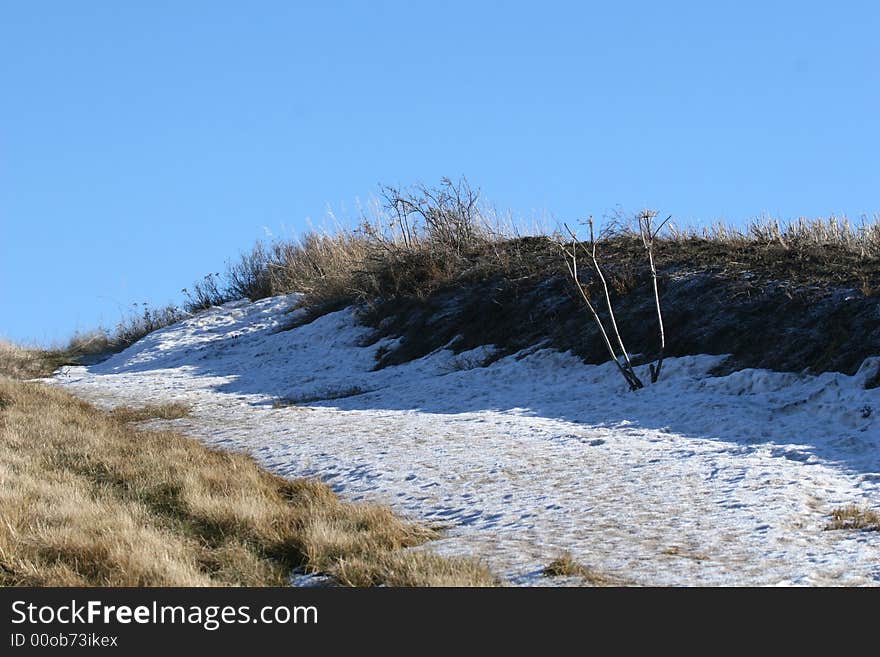 A frozen snow drift on a winter afternoon