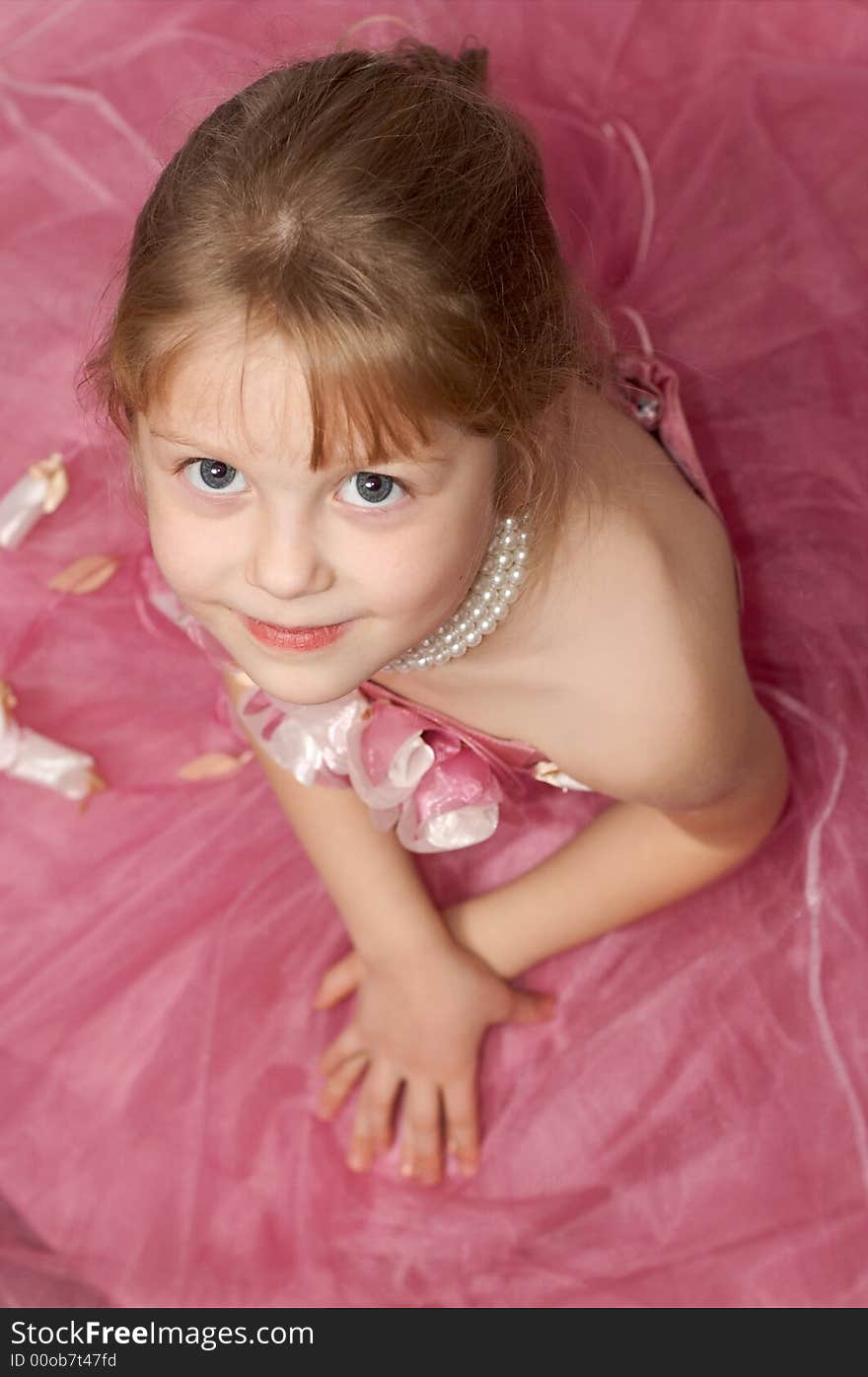 A girl in a beautiful pink dress. A girl in a beautiful pink dress