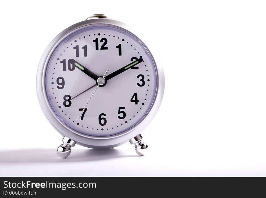 Classic alarm clock on white background