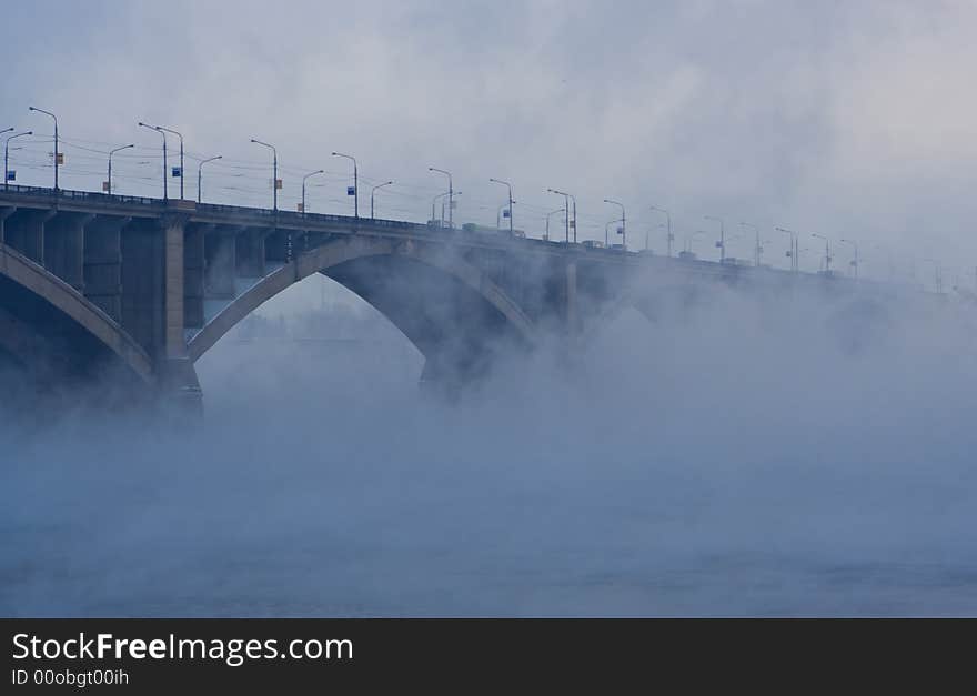 Bridge on river in cold steam