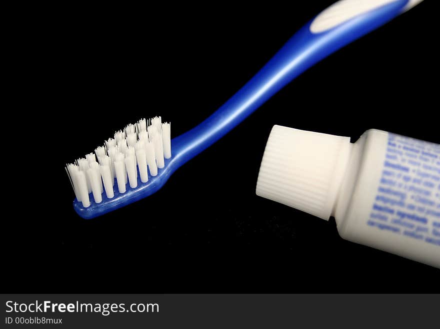 Blue toothbrush and toothpaste