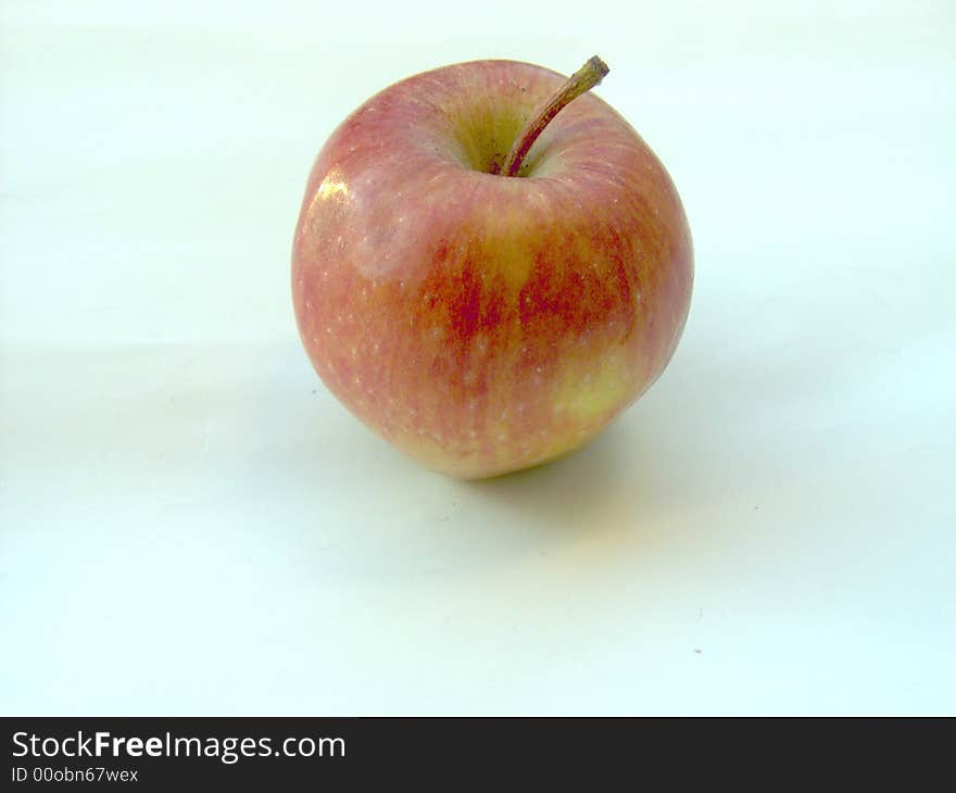 Red apple on light background