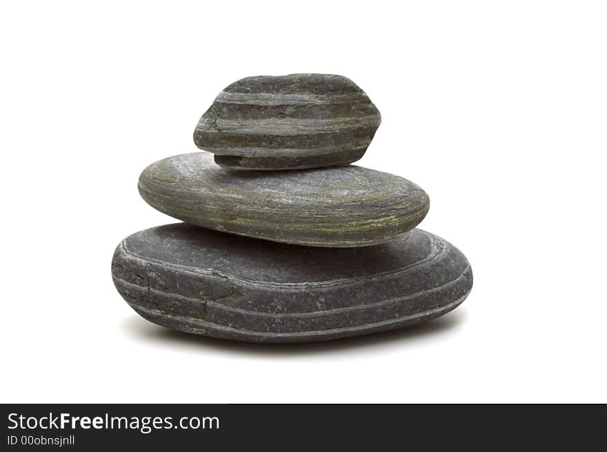 Three pebbles on white background