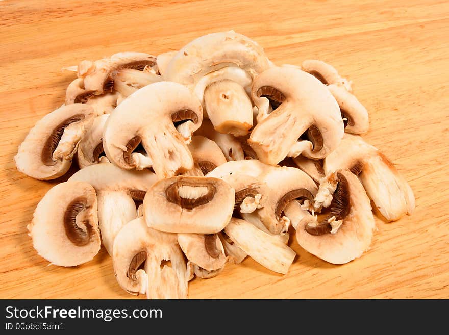 Cut mushrooms on chopping board