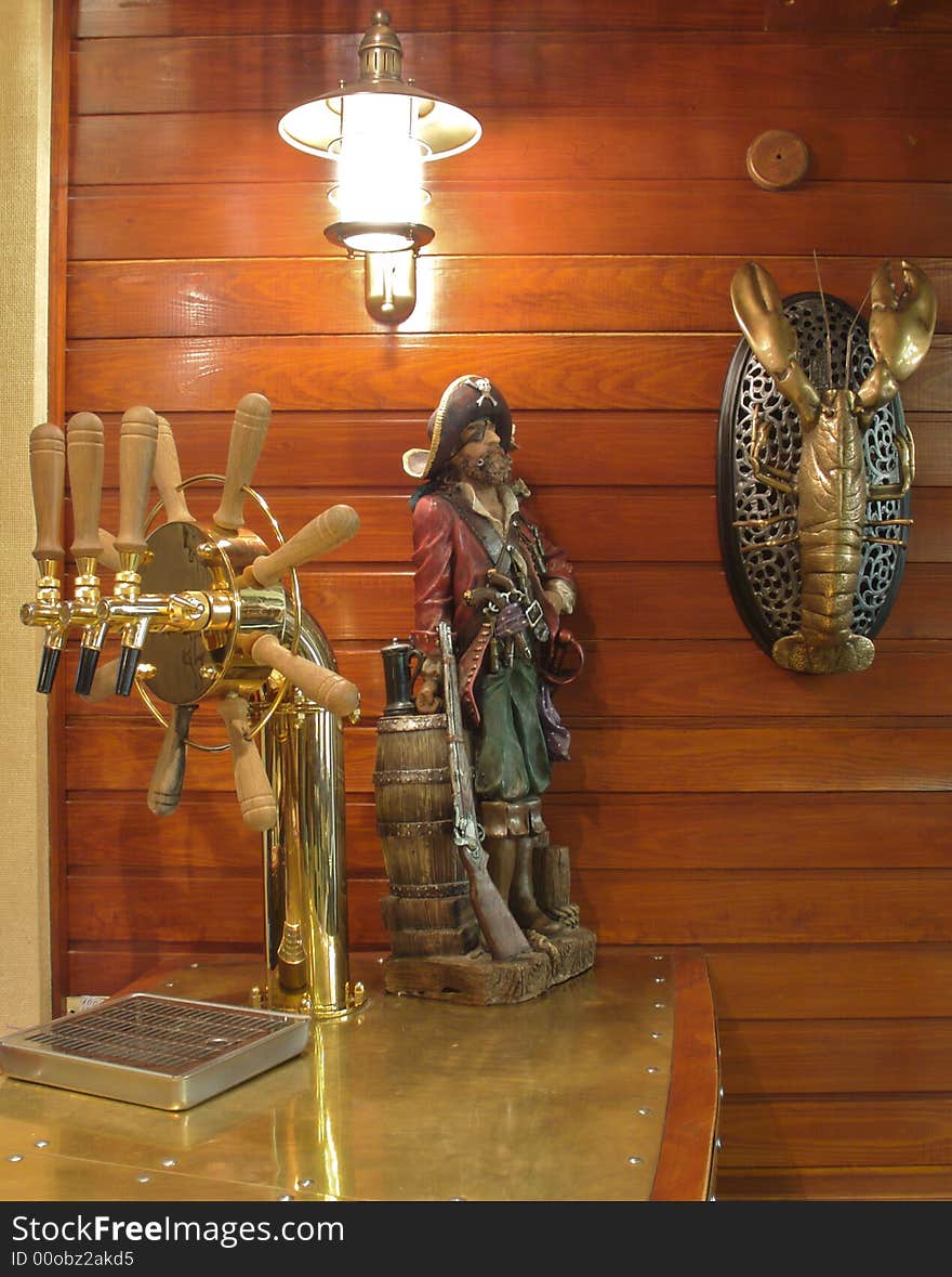 Fragment bar. Ornaments in the form of dolls - pirate. Krahn for bottling beer decorated knob.