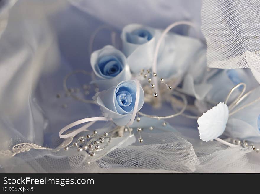 Blue roses and laces on a wedding gown. Blue roses and laces on a wedding gown