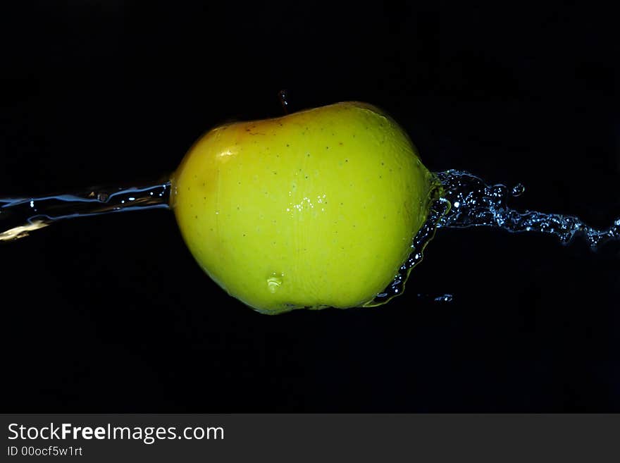 Green fresh apple motion in cold  water