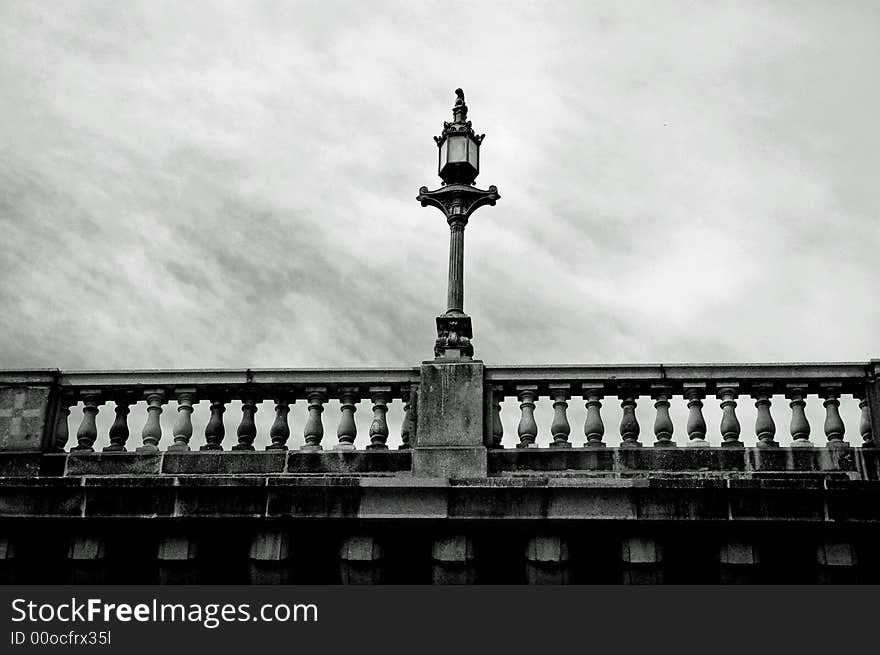 An upward shot of an old brick bridge done in black and white. An upward shot of an old brick bridge done in black and white.