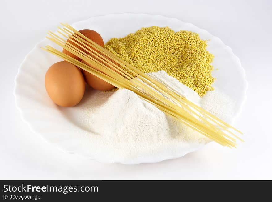 Egg, spaghetti, cereals and flour on white background. Egg, spaghetti, cereals and flour on white background