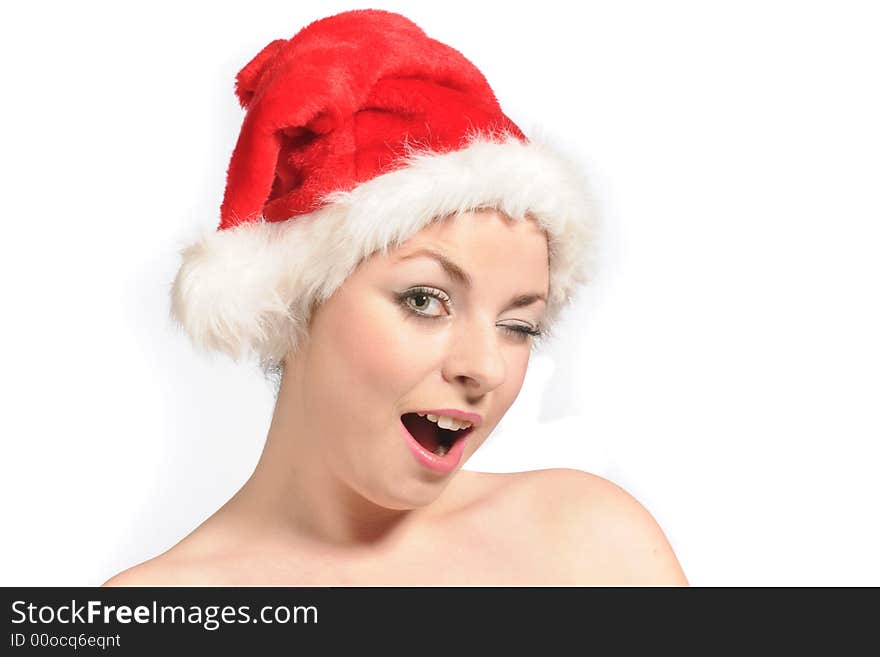 A young female model wearing a santa hat and a smile. A young female model wearing a santa hat and a smile