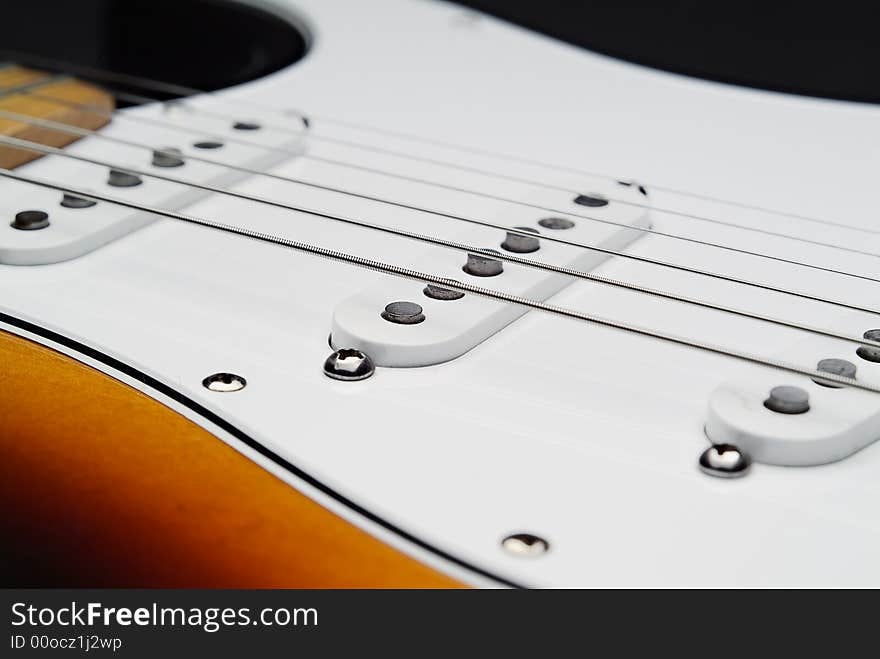 Close up of electric guitar and strings from the pick's point of view. Close up of electric guitar and strings from the pick's point of view