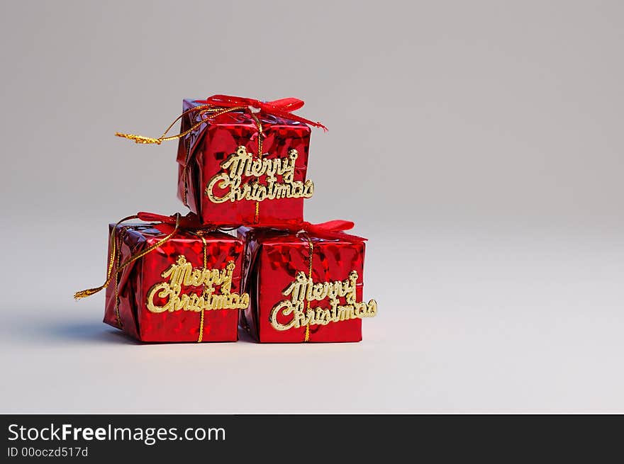 Red gifts on white background. Christmas decoration.