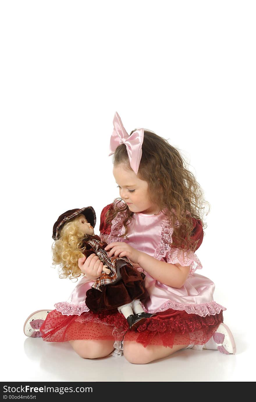 The little girl in a doll festive attire for masquerade