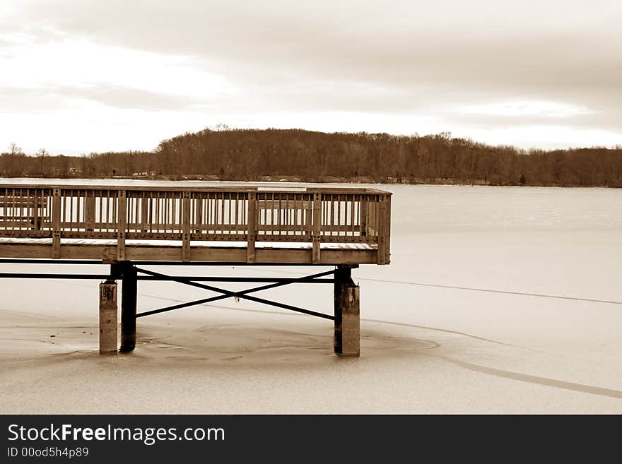 Wooden dock on a frozen lake