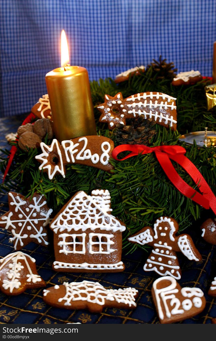 Christmas motive with advent candle
and gingerbread. Christmas motive with advent candle
and gingerbread