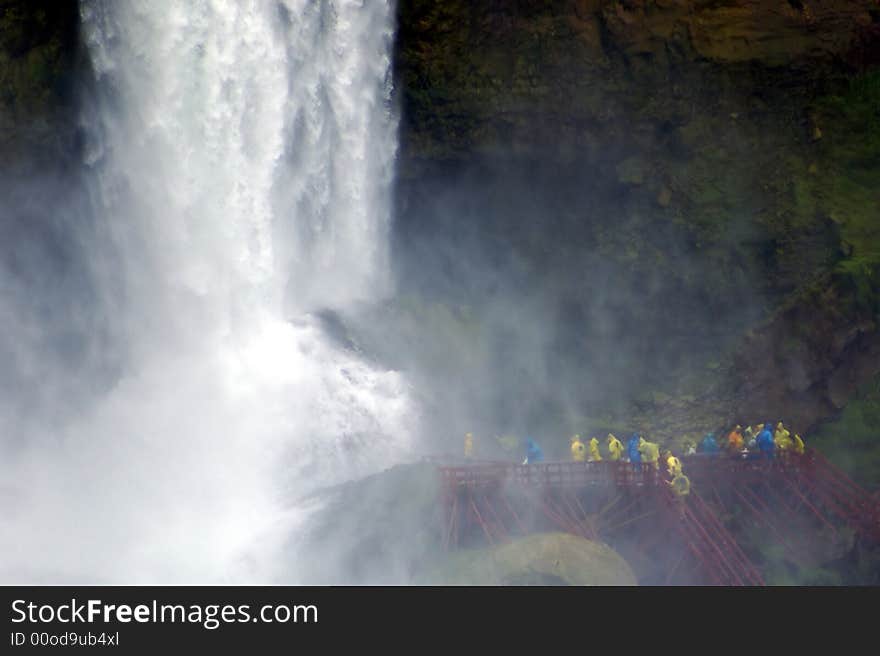 Tourists explore the base of the Bridal Veil falls, the smallest of Niagara's three great falls. Tourists explore the base of the Bridal Veil falls, the smallest of Niagara's three great falls.