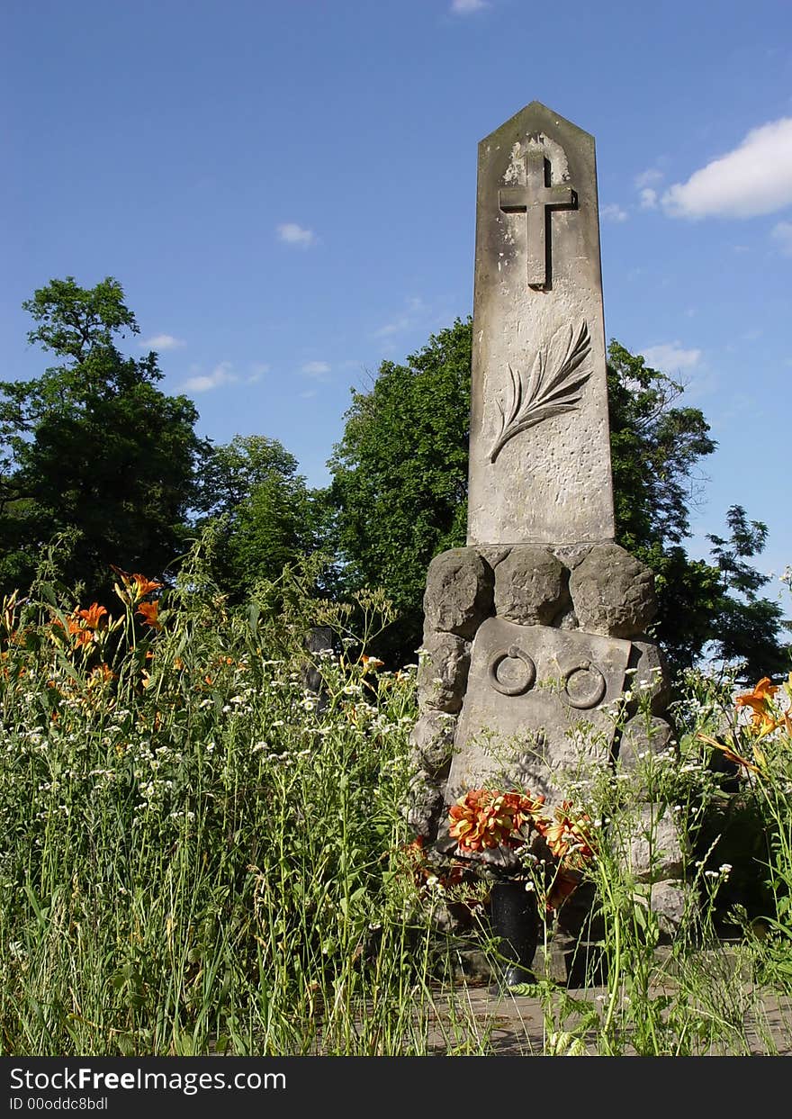 Old statue in cemetery. background