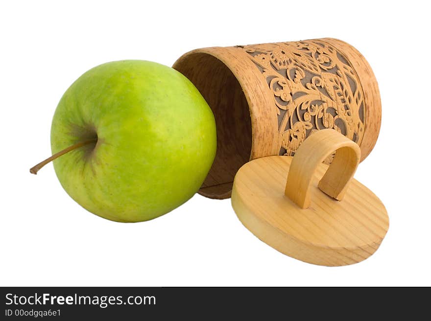 Accurate wooden gift box with a green apple isolated on white. Accurate wooden gift box with a green apple isolated on white