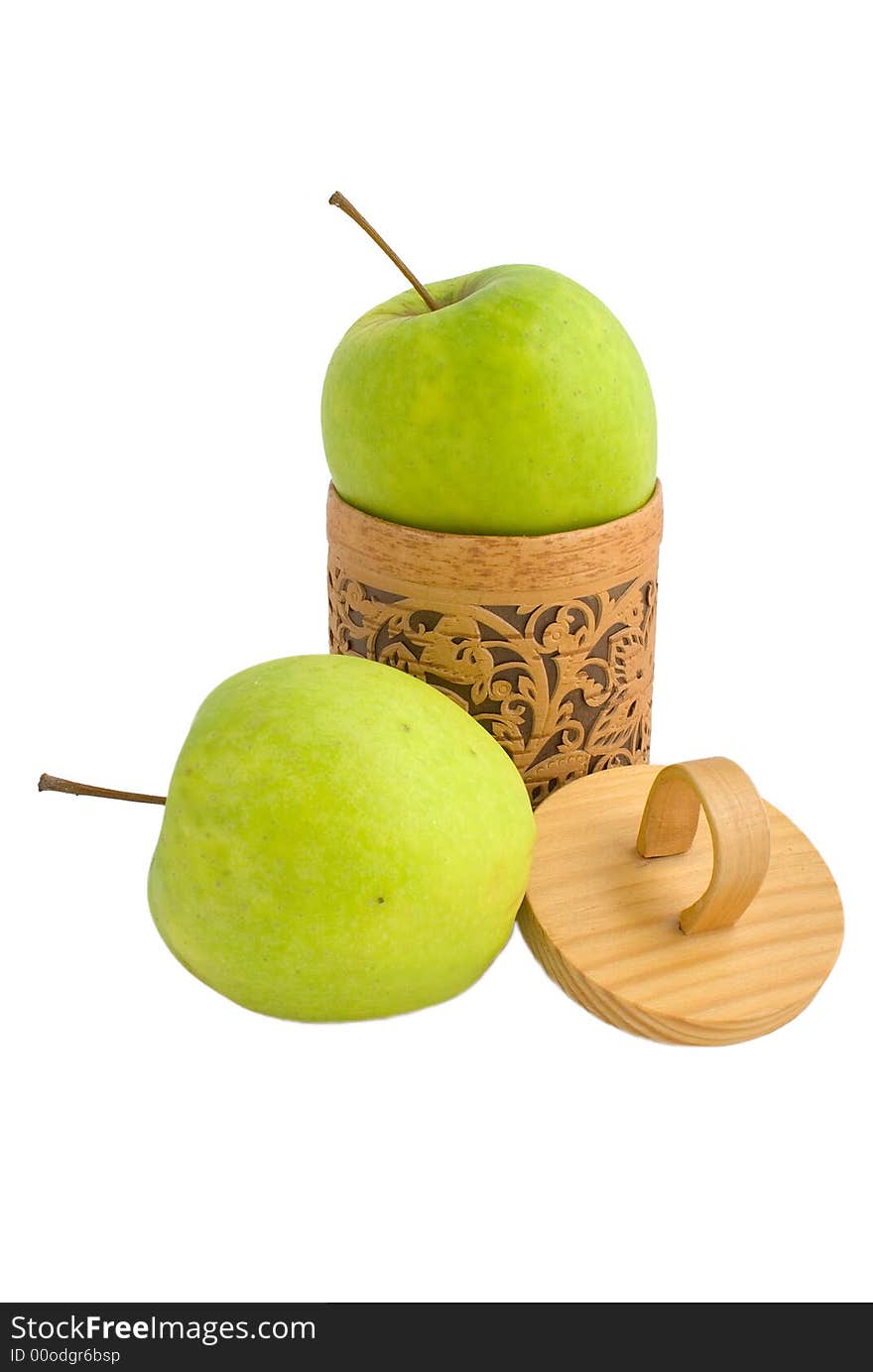 Accurate wooden gift box with two green apples isolated on white. Accurate wooden gift box with two green apples isolated on white