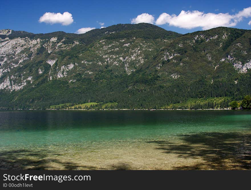 Summer landscape at the lake in mountains