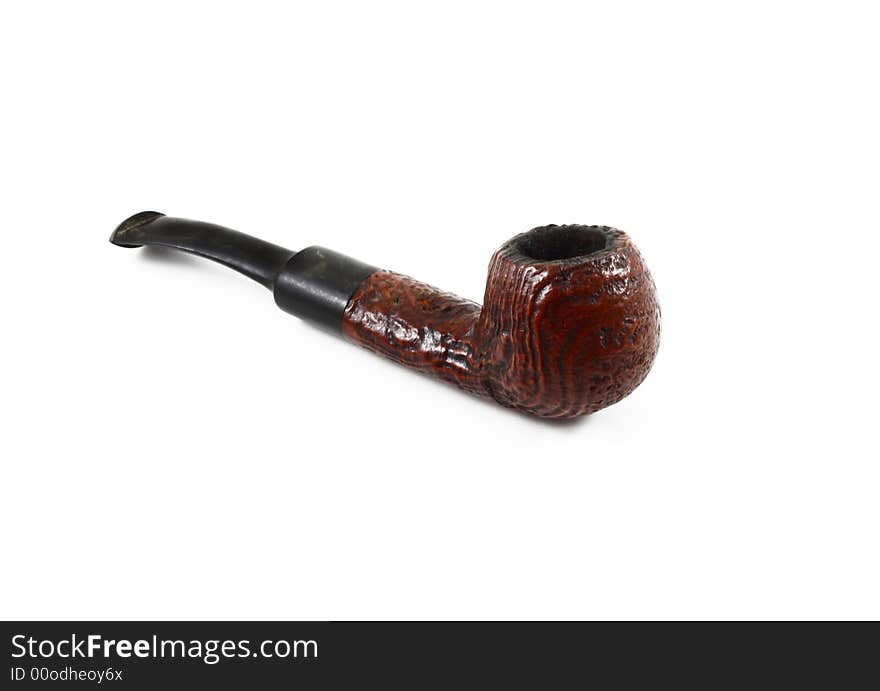 Brown old tobacco pipe on white background