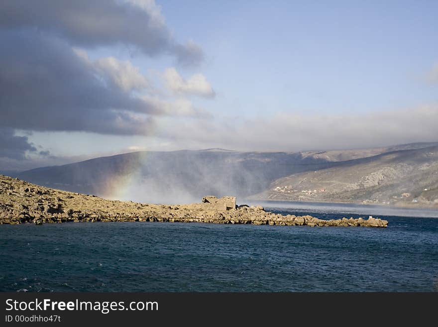 Strong wind strikes on rainbow