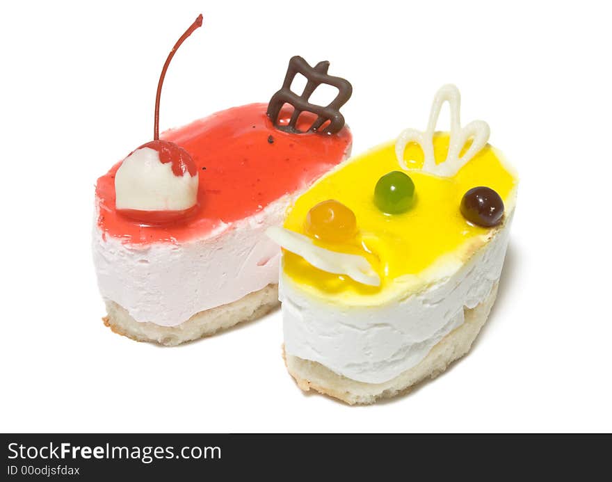 Closeup of two cheesecakes isolated on white background.